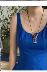 A model wearing a Miao embroidery necklace
